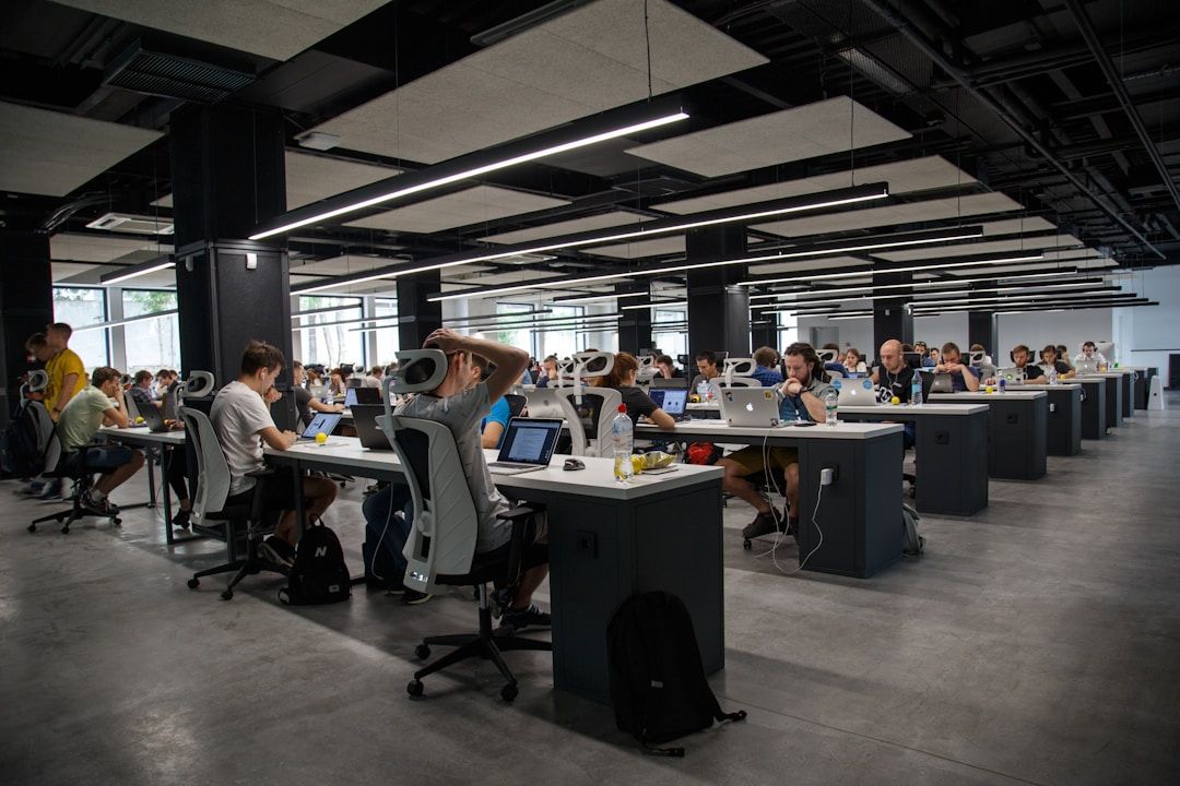 Corporate office with many desks where employees are utilizing popular contact center solutions